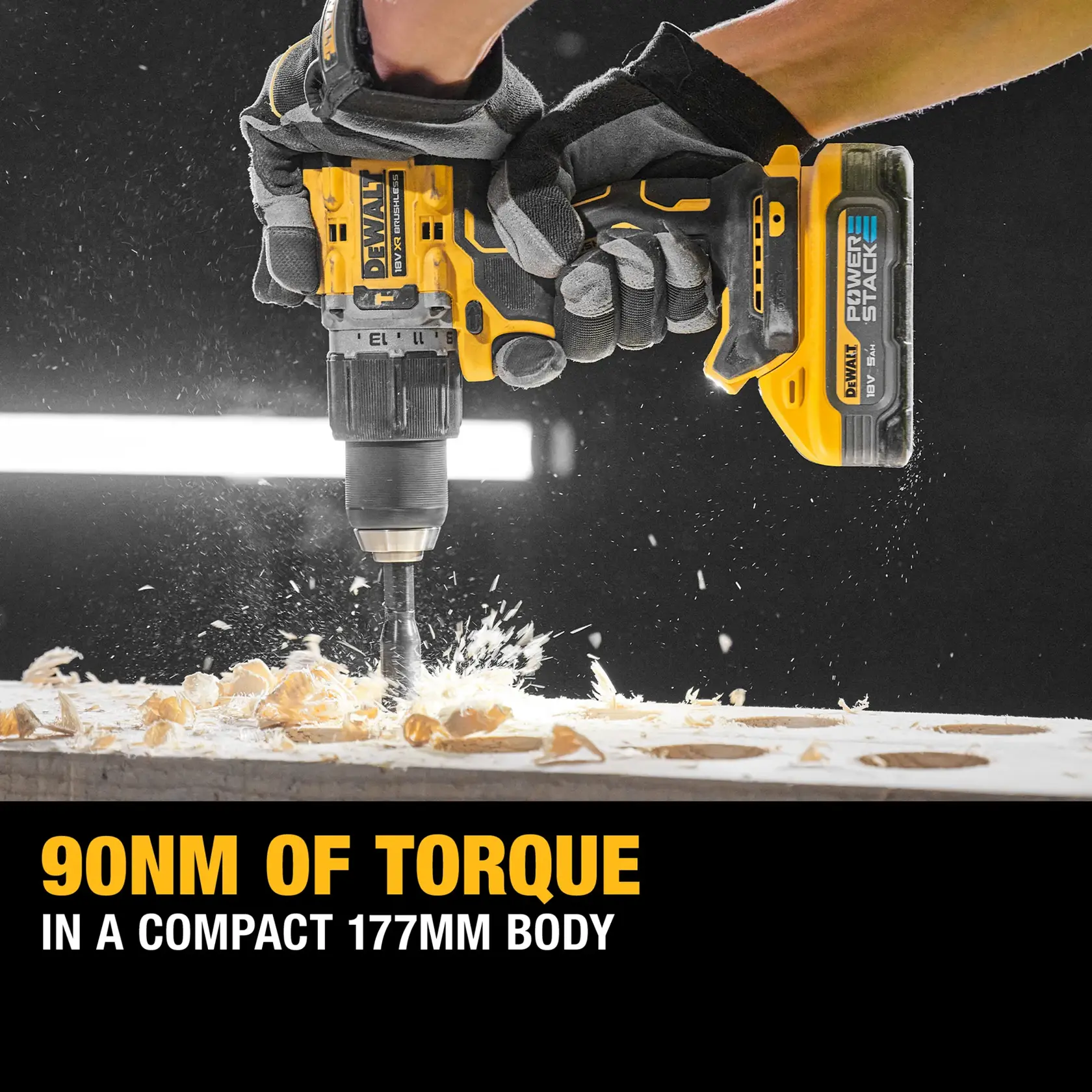DEWALT drill with POWERSTACK battery in use, drilling wood. Text: 90Nm torque, compact 177mm body.