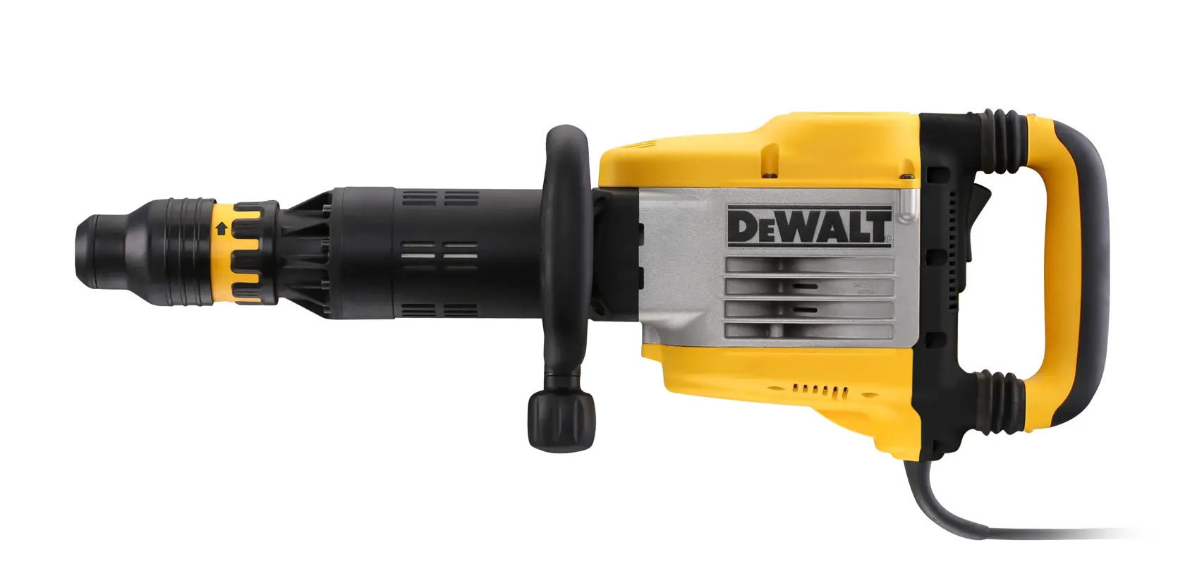 A person using a DEWALT D25951K demolition hammer to break concrete on a construction site, with debris scattered on the floor and additional DEWALT equipment visible in the background.