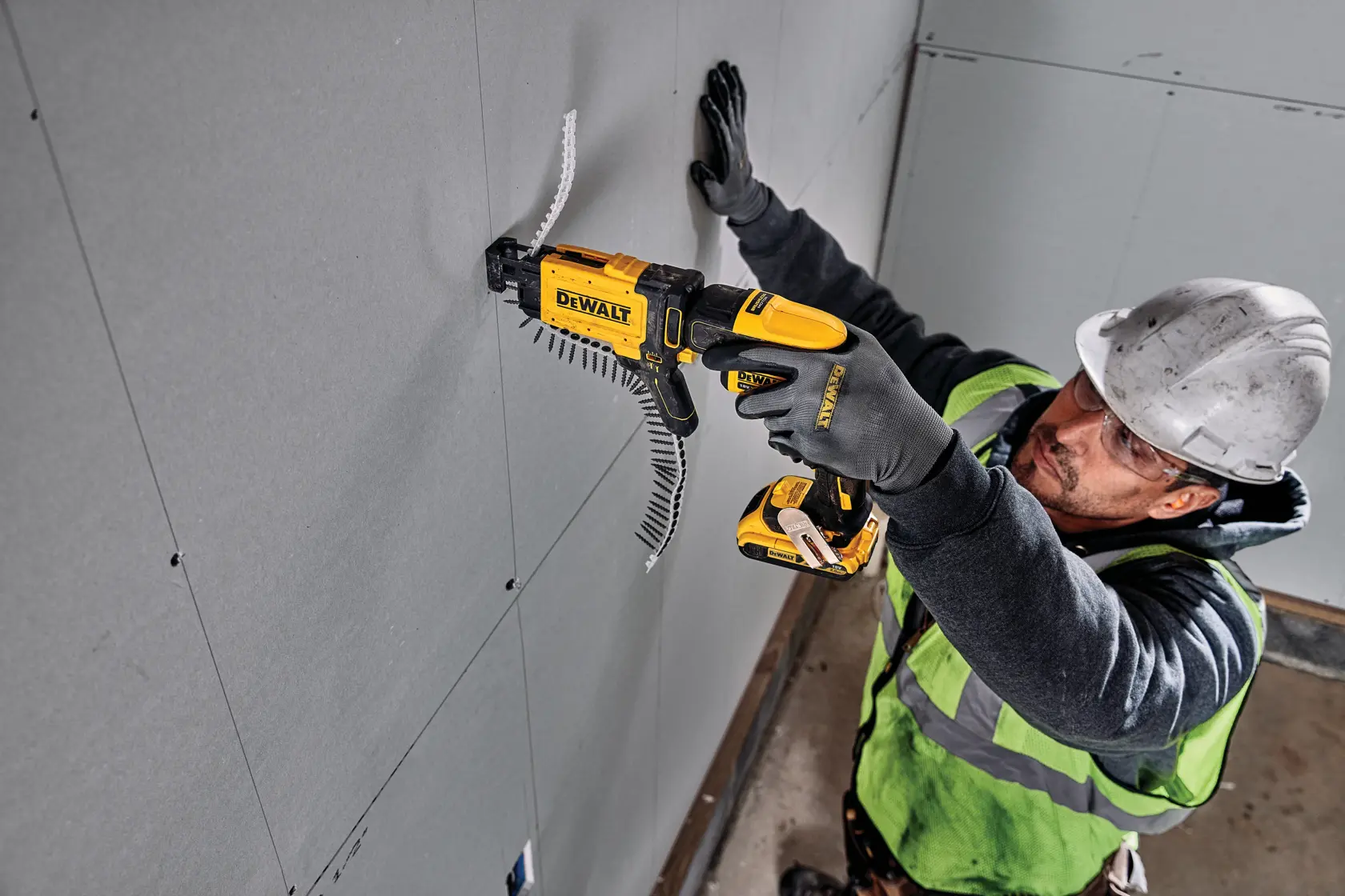 DEWALT DCF6202 drywall screw gun attachment, shown in a side profile with yellow and black casing, designed for use with compatible DEWALT power tools.