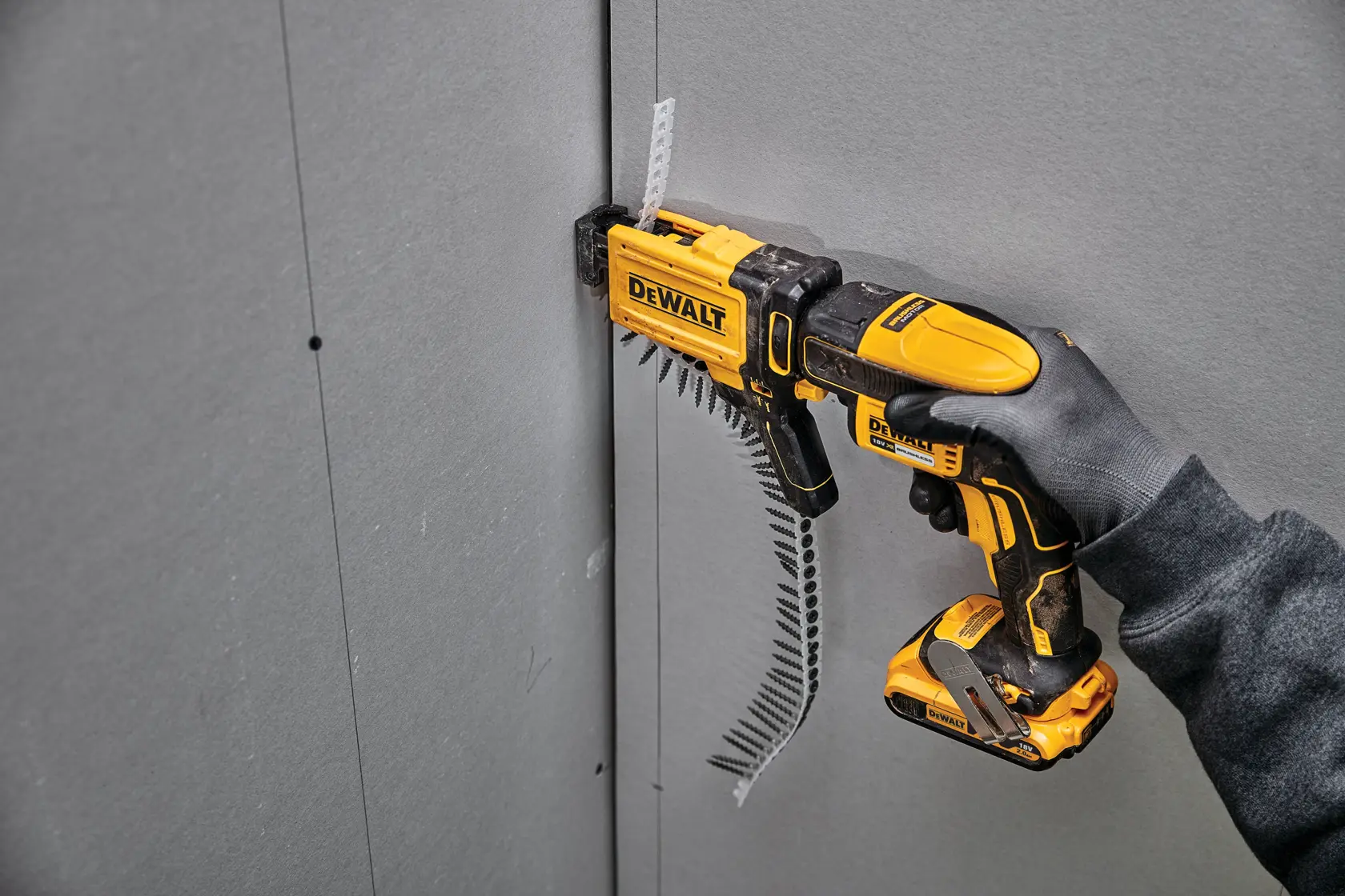 DEWALT DCF6202 drywall screw gun attachment, shown in a side profile with yellow and black casing, designed for use with compatible DEWALT power tools.