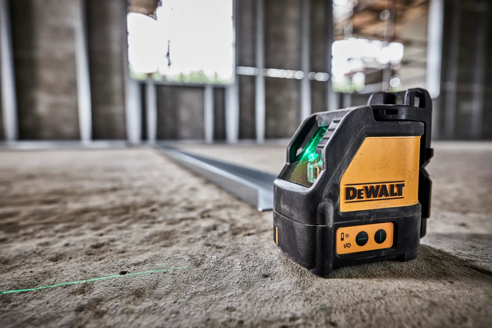 DEWALT DW088CG green cross line laser level, compact with a black and yellow design, used for precise leveling tasks.