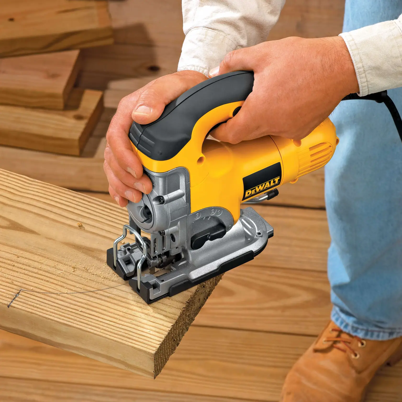 Person using a DEWALT jigsaw tool to cut a countertop surface indoors.