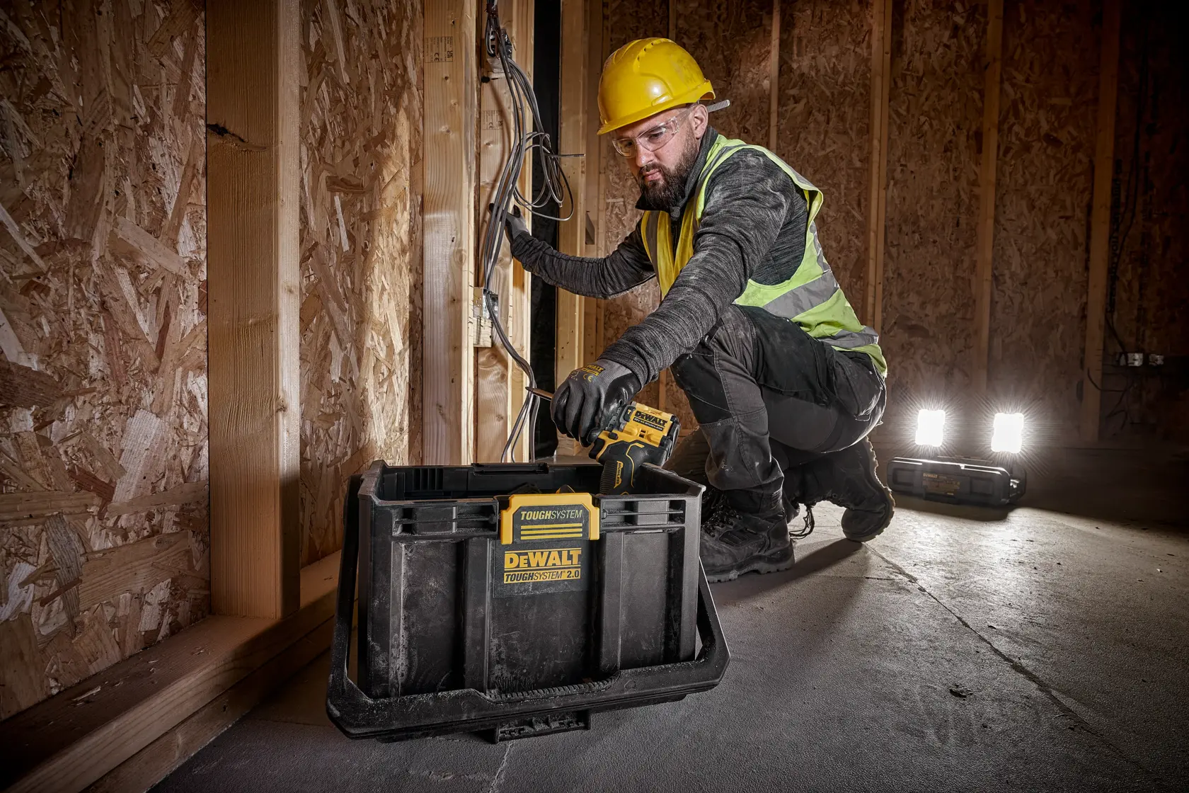 DEWALT ToughSystem 2.0 promotional graphic with the slogan 'Storage Built to Handle It' in large, bold yellow lettering on a dark, textured background.