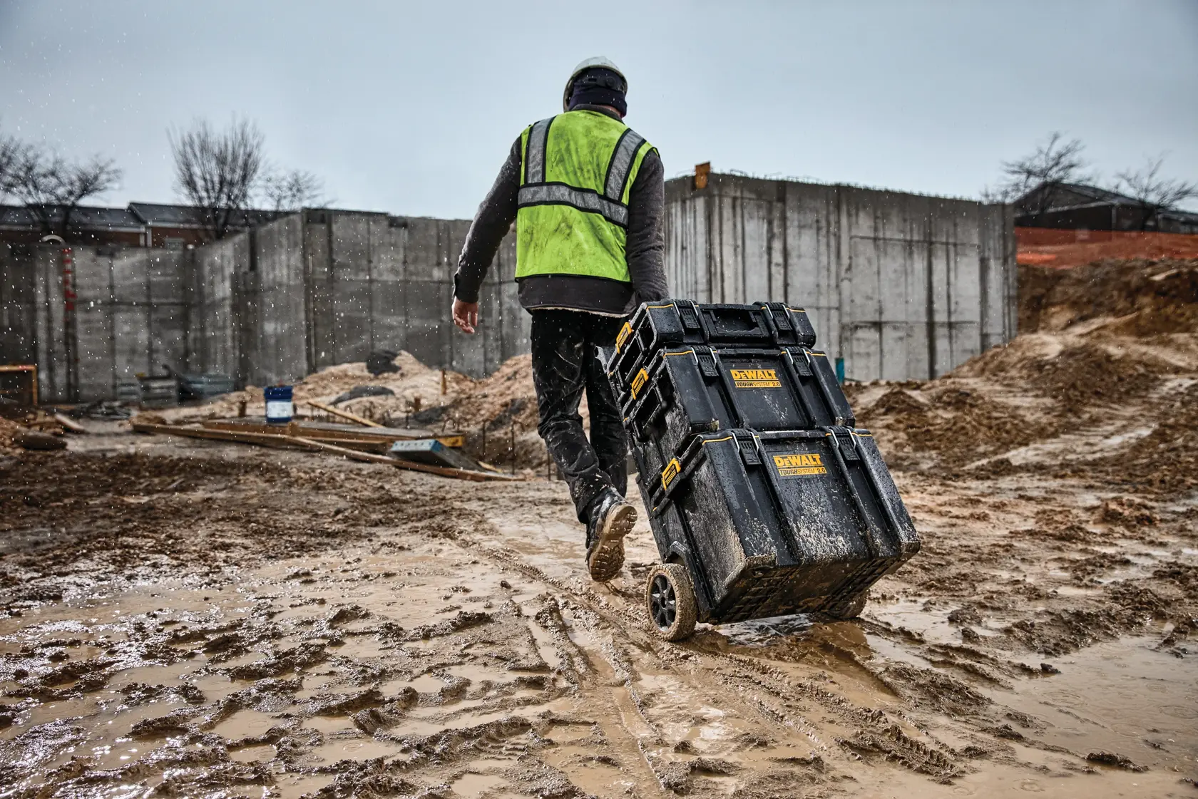 DEWALT ToughSystem 2.0 promotional graphic with the slogan 'Storage Built to Handle It' in large, bold yellow lettering on a dark, textured background.